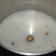Step two: Grind cooked rice and peppercorns, adding water to get a smooth liquid. Transfer the mixture to a saucepan.