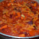 Step three: Add a cup of water. Stir well. Cover the pan. Cook till the veggies become soft and cooked.