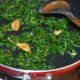 Sauteing the leaves.