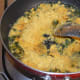 Step six: Add gram flour mix. Stir the mix continuously, so that there won't be any lumps.