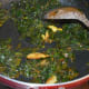 Step five: If the mix is dry, add half a cup of water. In the meanwhile, blend the gram flour with the remaining oil.
