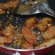Step seven: Add fried wedges. Mix gently. Add dried herbs, paprika or chili flakes, and a bit of salt. Mix together, so that wedges are coated with the seasonings.
