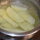 Boil until the wedges are 50% cooked. Turn off the heat. Strain the mix. Spread the wedges on a plate, so that they cool down completely.