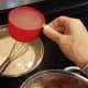 Then add your chicken broth. Season with salt and pepper and whisk until smooth.