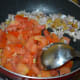Step five: Throw in tomatoes. Add remaining salt. Increase the heat. Stir-cook till tomatoes are a bit mushy. Turn off the heat. Set aside for cooling.
