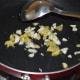 Step three: Add remaining oil. Throw in chopped ginger and garlic. Saute over medium low heat until they turn golden brown.