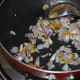 Step four: Add chopped onions. Continue sauteing till onions also become golden brown.
