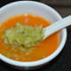Step eight: Keep ready four soup bowls. Add tomato puree equally to the bowls. Add sauteed cabbage equally to each bowl. Enjoy drinking this delightful and refreshing soup!