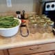 You'll need clean pint canning jars, a canning kit, a large ladle, a damp washrag, salt, measuring spoons, clean lids and rings, and green beans.