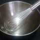 I prefer to use a whisk and a large metal bowl to incorporate all of the spices into the popcorn.