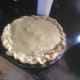 Roll out the smaller piece of dough and use it to top the pie.