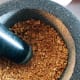 I used a mortar and pestle to pound the peanuts.