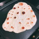 Cook the bread for a few minutes or until the bubbles formed on the bread turned to brown.