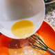 Pour the liquid mixture into the flour mixture.