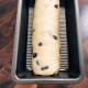 Transfer the dough into a greased loaf pan. Let it rest for 45 to 1 hour before baking.