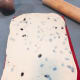 Use a rolling pin to roll the dough into a rectangle shape.