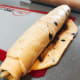 Roll the dough tightly from the top to bottom.
