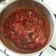 Curry sauce is brought to a simmer