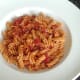Plated pasta in spicy tomato sauce