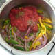 Tomatoes and herbs are added to vegetables