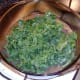 Curly kale is added to partly cooked liver casserole