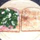 Kale and Stilton are arranged on hot bacon