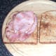 Bacon slices are laid on toast