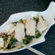 Tucking in to whiting on sauteed bacon and kale