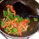 Gently sauteing onion, pepper and kale