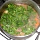Kale is added to partly cooked stew