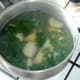 Potatoes and kale are simmered in boiling salted water