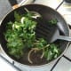 Kale and onion are gently sauteed in pork fat and juices