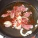 Chopped bacon and onions are seasoned with smoked paprika