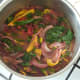 Pasta sauce is brought to a simmer