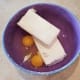 Then crack your eggs into your bowl. It's also important for these to be room temperature. If it's cold in your mixing bowl, your cream cheese will be lumpy and will never quite mix smooth for you.