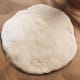 Transfer the dough onto a parchment-lined pan or tray.