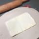 Place the thin sheet of butter in the middle of the dough and fold to create the pâton.