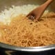 After onion and garlic are fragrant, add pasta.