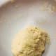 Continue kneading for awhile or until it forms a dough.