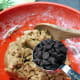 Add the chocolate chips into the mixture. Use a spatula to incorporate the ingredients.