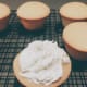 Use a frosting spatula or palette knife to spread the frosting on each cupcake.