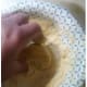 Dip the pickle chips in Fryin' Magic coating