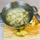 Place all the chopped potatoes in a pot with room temperature water. Always start them either in room temp or cold water. Hot water will start the cooking prematurely, and you will end up with overcooked and uneven potatoes.