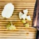 Slice the potatoes in half lengthwise and then in half again. Cut into even chunks about 1 inch in size.