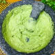 Add in the avocado pulp and again mash it until it is creamy with very few lumps.