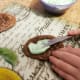 Spread a generous amount of frosting on each cookie.