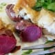 Breaded tilapia with roasted purple potatoes and watercress with a jalapeno vinaigrette sauce