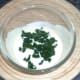 Chopped spinach is added to yoghurt