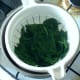 Drained spinach is left to cool