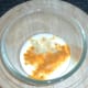 Turmeric and garlic are added to the yoghurt